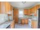 Kitchen with updated granite counters, tile floor and vintage cabinets at 2245 Julian St, Denver, CO 80211