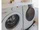 Modern laundry room featuring a washer and dryer at 2245 Julian St, Denver, CO 80211