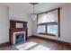 Bright room with hardwood floors, fireplace, and large windows offering natural light at 2245 Julian St, Denver, CO 80211