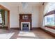 View of a room with a classic fireplace, hardwood floors, and a decorative chandelier at 2245 Julian St, Denver, CO 80211