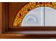 Elegant stained glass window with vibrant colors and intricate leaf pattern at 2245 Julian St, Denver, CO 80211