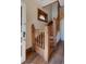 Elegant wooden staircase featuring detailed woodwork and a stained-glass window at 2245 Julian St, Denver, CO 80211