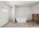 New bathroom with a free-standing bathtub, window and drywall at 3530 Chase St. St, Wheat Ridge, CO 80212