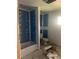 Bathroom under construction with a white toilet, tiled shower, and blue walls at 3530 Chase St. St, Wheat Ridge, CO 80212
