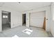 Unfinished bedroom featuring an open doorway leading to a bright, sunlit bathroom at 3530 Chase St. St, Wheat Ridge, CO 80212