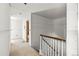 Hallway featuring unfinished walls and staircase with decorative railings at 3530 Chase St. St, Wheat Ridge, CO 80212
