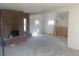 Newly renovated open living room with a brick fireplace and modern lighting at 3530 Chase St. St, Wheat Ridge, CO 80212