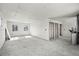 Large, unfinished room with drywall, three door frames, and two windows at 3530 Chase St. St, Wheat Ridge, CO 80212