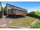 Elevated back deck offers serene backyard views, perfect for relaxing and entertaining at 2430 E 109Th Dr, Northglenn, CO 80233