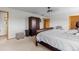 Bedroom with neutral colored carpet, a ceiling fan, walk-in closet, and a sitting area at 2430 E 109Th Dr, Northglenn, CO 80233