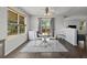 Charming dining area featuring a round table, hardwood floors, and natural light at 2430 E 109Th Dr, Northglenn, CO 80233