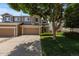 Charming townhome featuring a two-car garage, well-maintained landscaping, and appealing curb appeal at 2430 E 109Th Dr, Northglenn, CO 80233