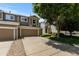 Charming townhome featuring a two-car garage, well-maintained landscaping, and inviting curb appeal at 2430 E 109Th Dr, Northglenn, CO 80233