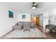 Cozy living room with hardwood floors, neutral decor, and comfortable seating arrangement at 2430 E 109Th Dr, Northglenn, CO 80233