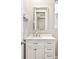Bathroom featuring a white vanity with modern hardware and a large mirror at 14850 Munich Ave, Parker, CO 80134