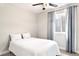 Comfortable bedroom with great natural light, neutral walls, and a ceiling fan at 14850 Munich Ave, Parker, CO 80134