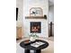 Elegant fireplace with white brick surround and a decorative mantel at 14850 Munich Ave, Parker, CO 80134