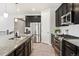 Modern kitchen featuring stainless steel appliances, granite countertops, and sleek cabinets at 14850 Munich Ave, Parker, CO 80134