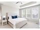 Bright main bedroom featuring a tray ceiling and a large window bringing in natural light at 14850 Munich Ave, Parker, CO 80134