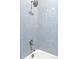 Bright shower featuring light blue subway tile surround, and rainfall showerhead at 14850 Munich Ave, Parker, CO 80134