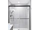Modern shower with geometric tiling, black fixtures, and glass door at 14850 Munich Ave, Parker, CO 80134