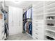 Spacious walk-in closet with custom shelving, drawers, and cabinets for optimal organization at 14850 Munich Ave, Parker, CO 80134