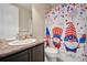 Bathroom featuring a unique shower curtain, modern fixtures, and a clean, welcoming atmosphere at 19760 W 59Th Dr, Golden, CO 80403