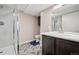 Modern bathroom showcasing a glass-enclosed shower, herringbone flooring, and a vanity at 19760 W 59Th Dr, Golden, CO 80403