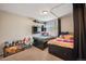 Shared bedroom featuring two beds, built-in shelves, and a cozy atmosphere perfect for siblings at 19760 W 59Th Dr, Golden, CO 80403