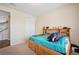 Comfortable bedroom with ample storage space and natural light, creating a cozy retreat at 19760 W 59Th Dr, Golden, CO 80403