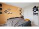 This bedroom features a comfortable bed, unique decor and a large closet with white doors at 19760 W 59Th Dr, Golden, CO 80403