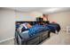 Cozy bedroom featuring two beds, storage, and an American flag, perfect for  at 19760 W 59Th Dr, Golden, CO 80403