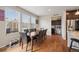 Inviting dining room with hardwood floors, natural light, and a modern table set at 19760 W 59Th Dr, Golden, CO 80403