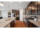 Well-equipped kitchen showcasing stainless steel appliances and stone countertops at 19760 W 59Th Dr, Golden, CO 80403