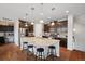 Gourmet kitchen boasts an island, stainless steel appliances, and dark wood cabinetry at 19760 W 59Th Dr, Golden, CO 80403