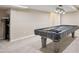 Finished basement showcasing a pool table beneath modern lighting with neutral walls and carpet at 19760 W 59Th Dr, Golden, CO 80403