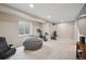 Spacious finished basement featuring an exercise bike and comfortable seating area at 19760 W 59Th Dr, Golden, CO 80403