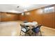 Spacious finished basement featuring vinyl floors and wood paneling, perfect for entertaining or relaxing at 12046 W Green Mountain Dr, Lakewood, CO 80228