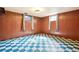 Finished basement with vinyl flooring and painted paneling offering space for activities at 12046 W Green Mountain Dr, Lakewood, CO 80228