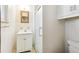 Bathroom featuring a tiled shower with glass door, vanity with sink, and medicine cabinet at 12046 W Green Mountain Dr, Lakewood, CO 80228