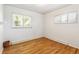 Bright bedroom featuring hardwood floors and two windows for lots of natural light at 12046 W Green Mountain Dr, Lakewood, CO 80228