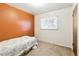 Cozy bedroom with warm, natural light, wall paint, and a comfortable bed and flooring at 12046 W Green Mountain Dr, Lakewood, CO 80228