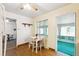 Breakfast nook with table, seating for two, and views to the Gathering room at 12046 W Green Mountain Dr, Lakewood, CO 80228