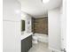 Bathroom featuring a modern vanity, tile shower, and contemporary fixtures at 9484 W 89Th Cir, Broomfield, CO 80021