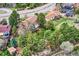 Aerial view of a neighborhood showcasing the property's proximity to mature trees and homes at 8687 N Pinery Pkwy, Parker, CO 80134