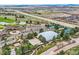 Overhead view of the golf course and tennis courts, highlighting community amenities near the highway at 8687 N Pinery Pkwy, Parker, CO 80134