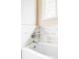 Close up of a bathtub showing the white marble tile and the sleek, modern faucet and fixtures at 8687 N Pinery Pkwy, Parker, CO 80134