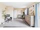 Bedroom features neutral walls, plenty of storage, and comfy sitting area at 8687 N Pinery Pkwy, Parker, CO 80134