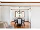 Well-lit dining room showcasing hardwood floors and modern chandelier at 8687 N Pinery Pkwy, Parker, CO 80134