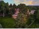 Lush backyard featuring a two-story home with a beautiful outdoor patio, deck, and a verdant lawn at 8687 N Pinery Pkwy, Parker, CO 80134